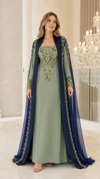Model wearing Sage Green embroidered kaftan evening gown with contrast cape