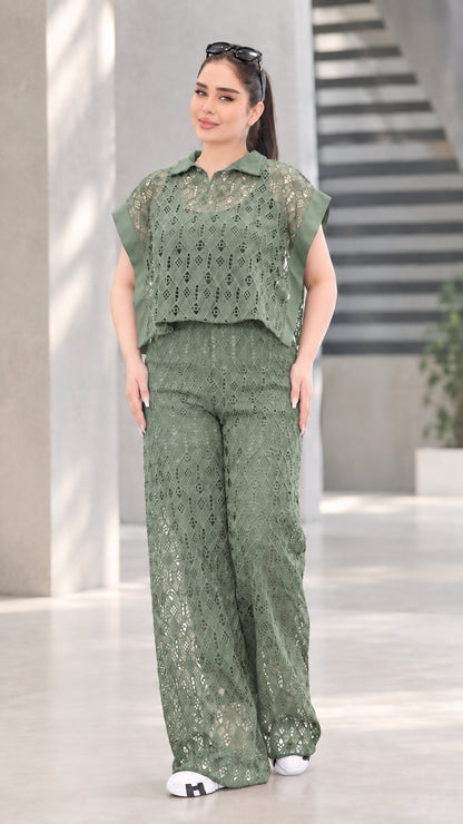 Front view of woman wearing sage green lace two-piece top and wide-leg pants set