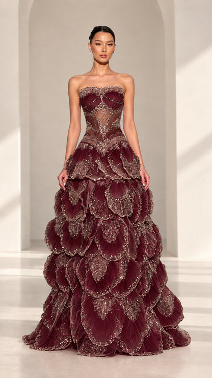 Front view of strapless beaded corset petal evening gown in Burgundy