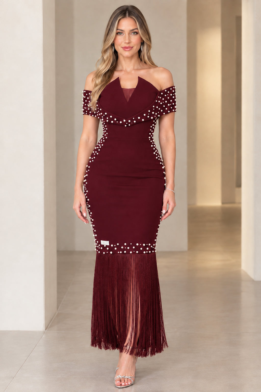 Model wearing burgundy wine red pearl embellished off-the-shoulder formal dress