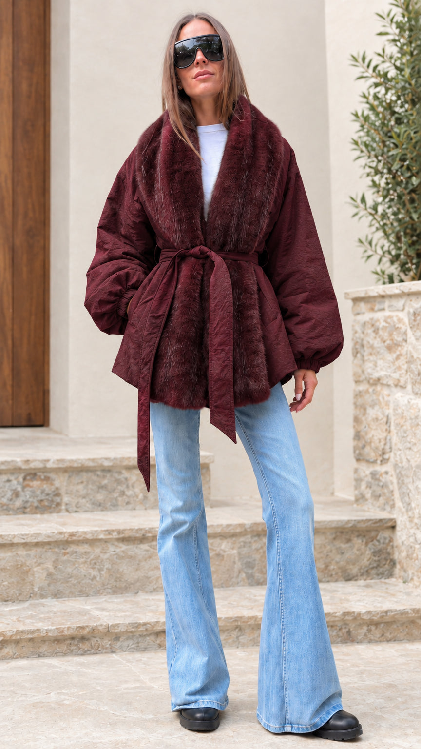 Woman modeling rich burgundy wine red belted jacket with matching faux fur collar
