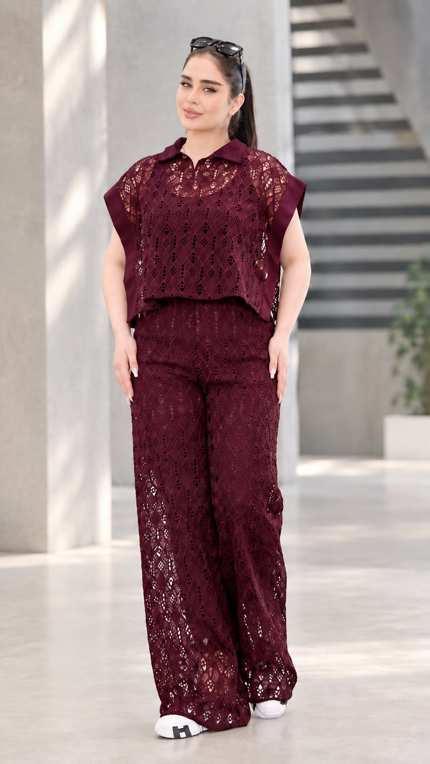Front view of woman wearing burgundy wine lace two-piece top and wide-leg pants set