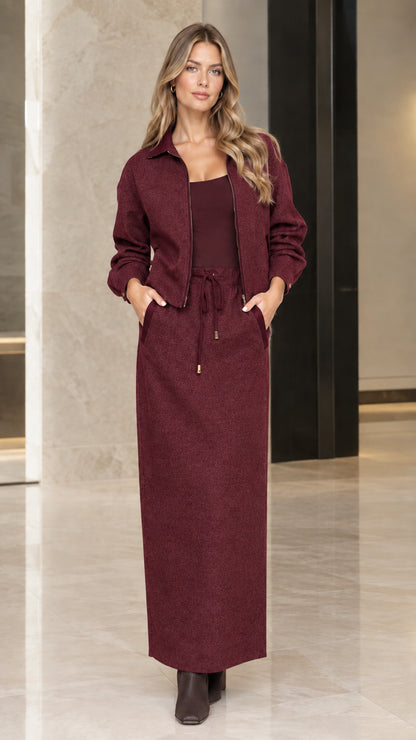 Model wearing Burgundy two-piece zip jacket and maxi skirt set