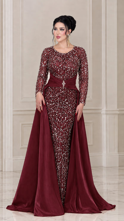 Front view of the burgundy wine sequin evening gown featuring a satin overskirt