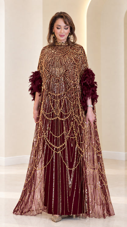 Burgundy wine beaded cape evening gown with feather accents
