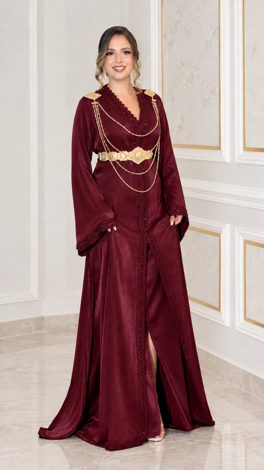 Burgundy satin kaftan evening dress with gold hardware and chain belt