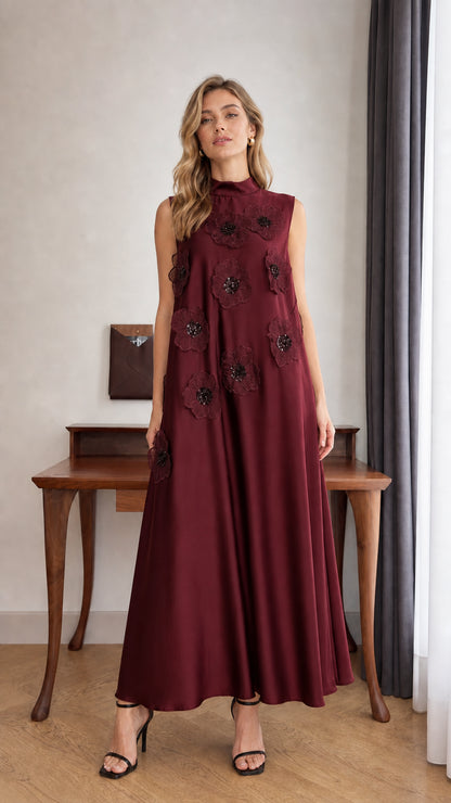 Model wearing Burgundy sleeveless 3D floral applique high neck maxi dress