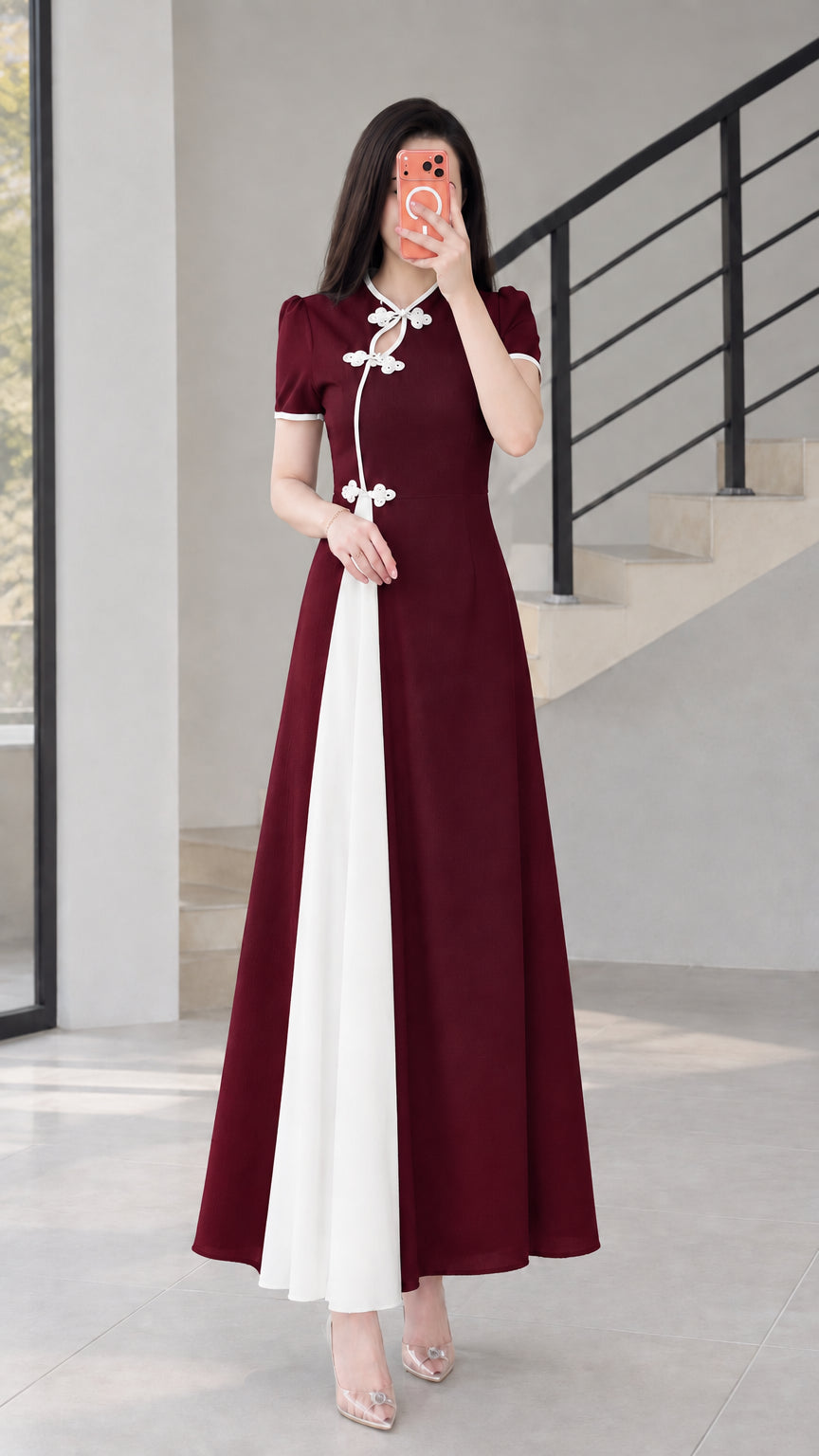 Front view of burgundy red modern cheongsam maxi dress with white contrast panel