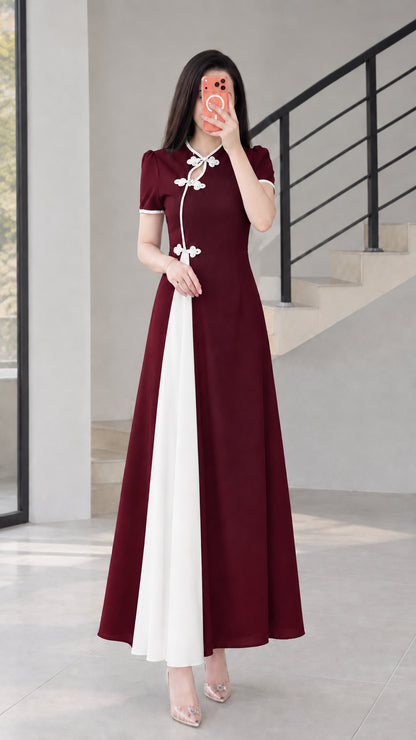 Front view of burgundy red modern cheongsam maxi dress with white contrast panel