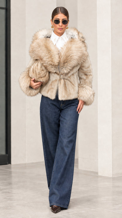 Woman wearing light beige cream plush hooded short jacket with tonal faux fur trim