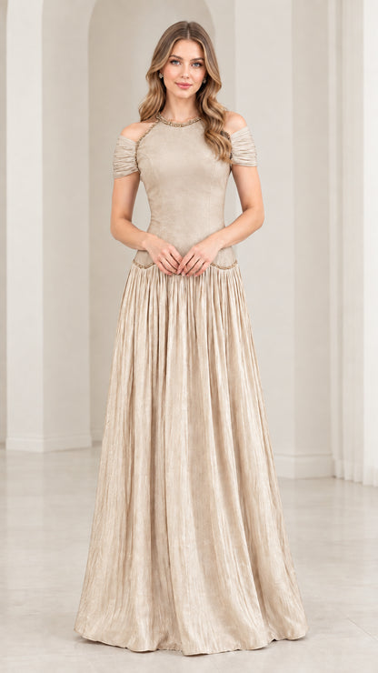 Woman wearing champagne beige cold shoulder beaded pleated maxi dress