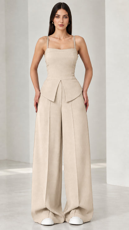 Full front view of model wearing beige square neck peplum wide leg jumpsuit