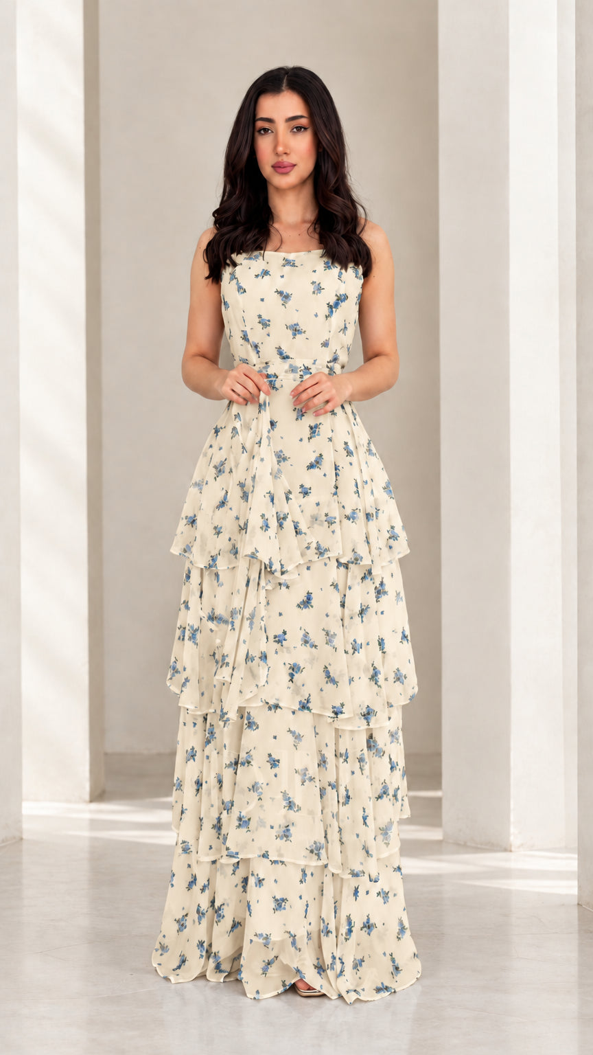 Model wearing cream floral tiered ruffle maxi dress