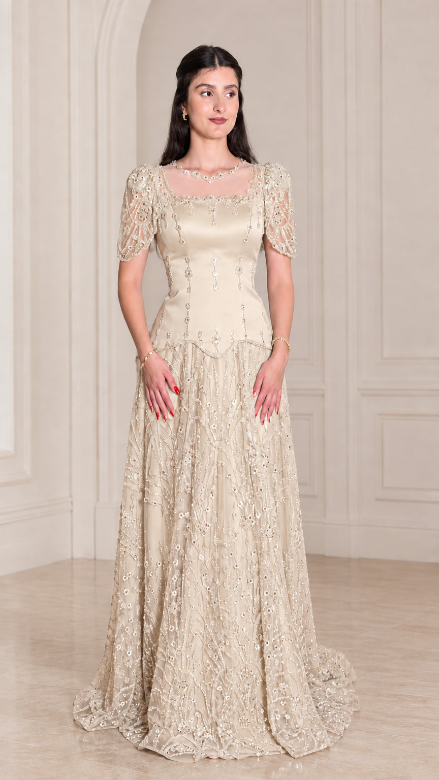 Model wearing Champagne gold embroidered formal evening gown