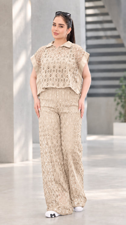 Front view of woman wearing beige khaki lace two-piece top and wide-leg pants set