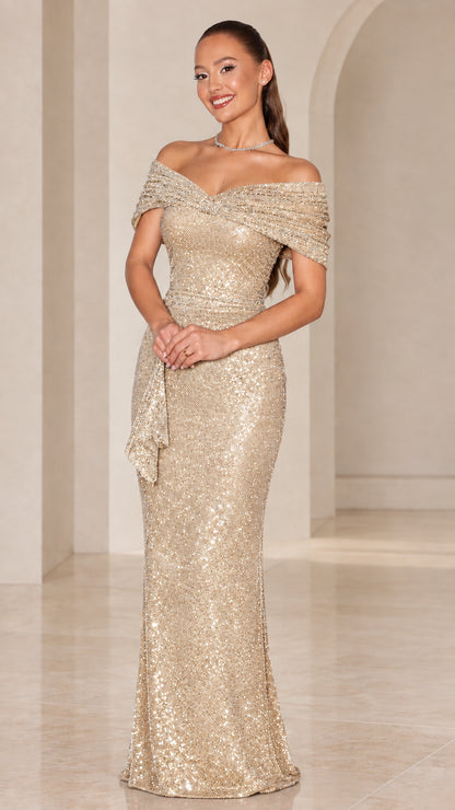 Model wearing sparkling champagne gold off-the-shoulder sequin floor-length dress