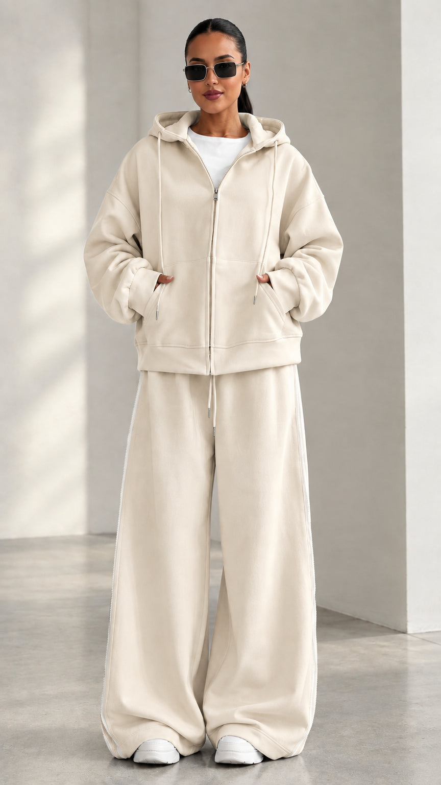 Model wearing Cream beige zip-up hoodie and matching wide-leg track pants set