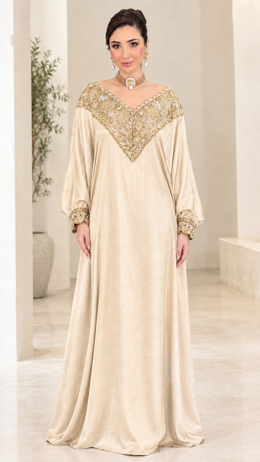 Front view of champagne beige kaftan maxi dress with gold beadwork